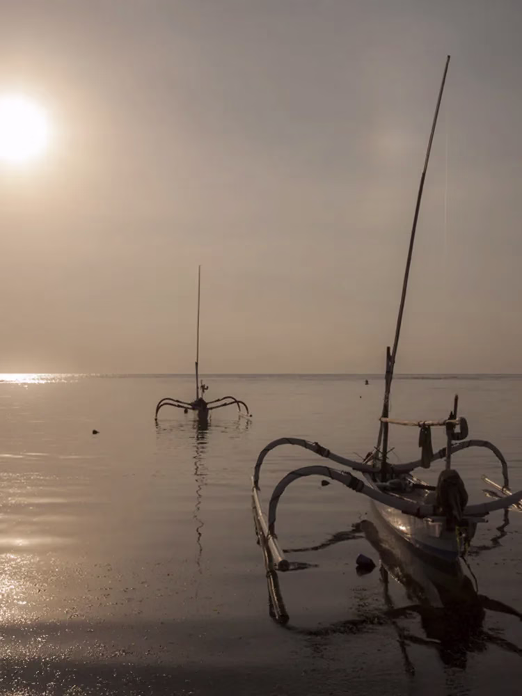 balinese boats with sunset