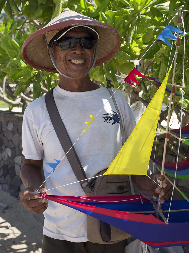 balinese man with ship kite